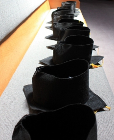 Grad hats in a line
